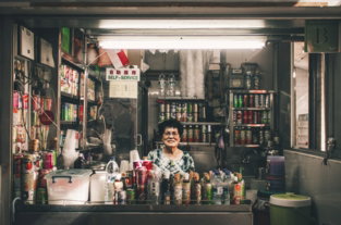 woman sitting in front of label container lot